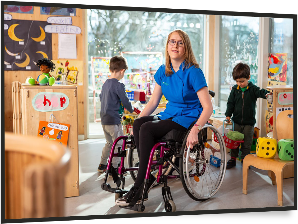 young girl in wheelchair in a nursery