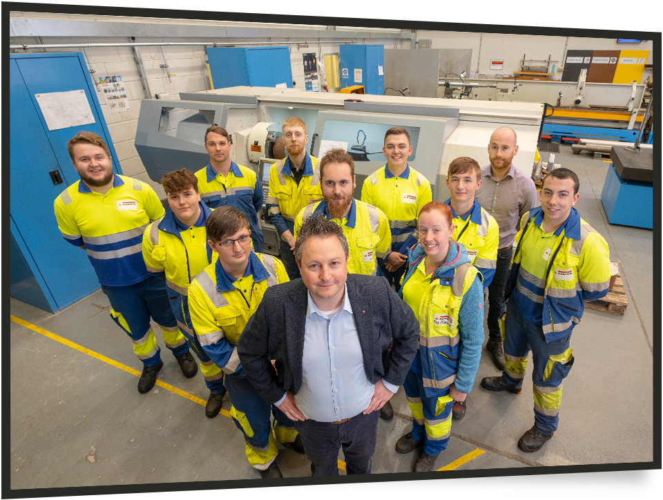 group of male and female engineers looking at camera