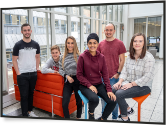 Young apprentices in an office