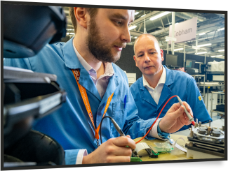 young male and older male using electrical equipment