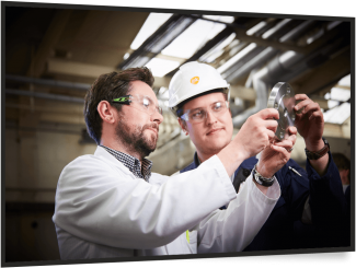 2 men inspecting a mechanical part