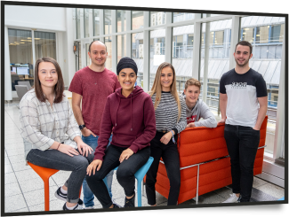Young apprentices in an office